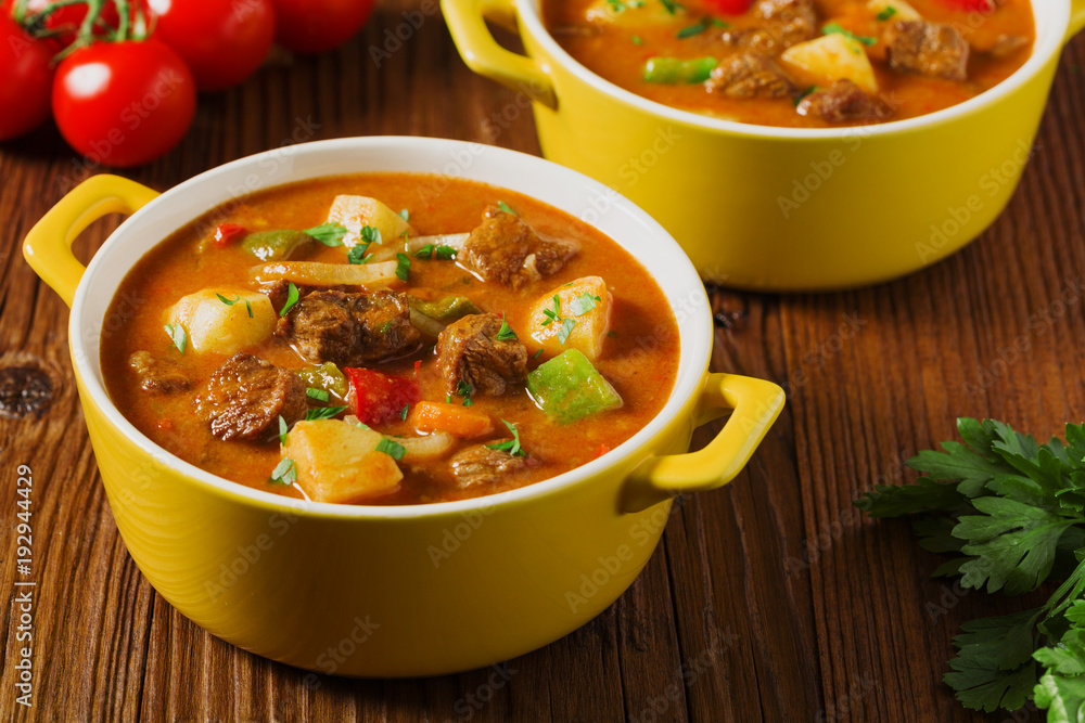 Beef stew served with cooked potatoes. Beef stew served with cooked potatoes.