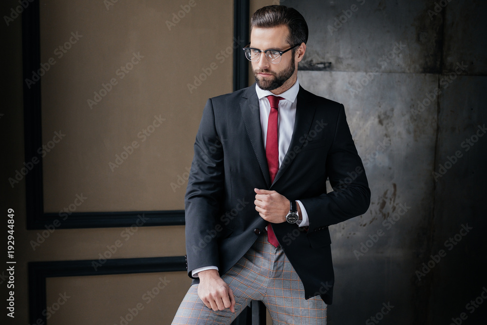handsome stylish businessman posing in suit handsome stylish businessman posing in suit