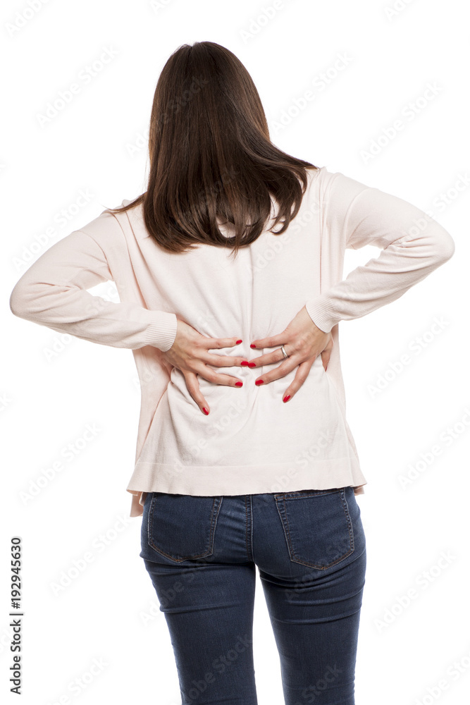 young woman with back pain on white background young woman with back pain on white background