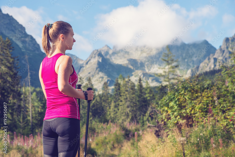 Young woman hiking in the mountains