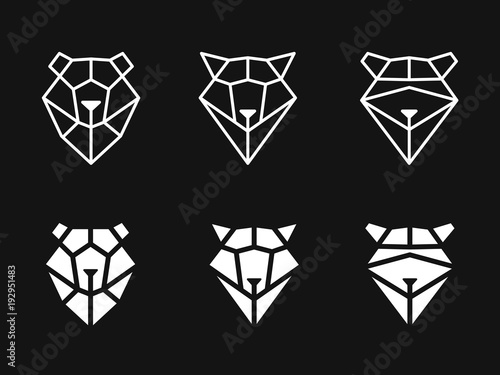 Heads of bear, raccoon, wolf from triangles on dark background