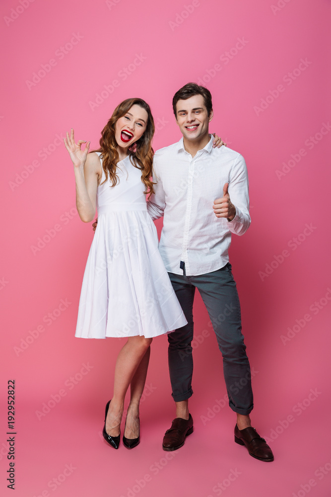 Full length portrait of a cheerful smartly dressed couple Full length portrait of a cheerful smartly dressed couple