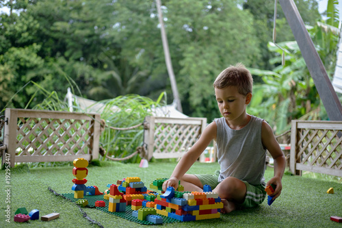 Wallpaper Mural Boy playing with plastic construction toys. Amusement playground. Thailand Torontodigital.ca