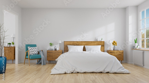 Scandinavian interior of bedroom concept design,blue lounge chair with wood bedside table and white bed  on white wall ,empty room ,3d rendering photo