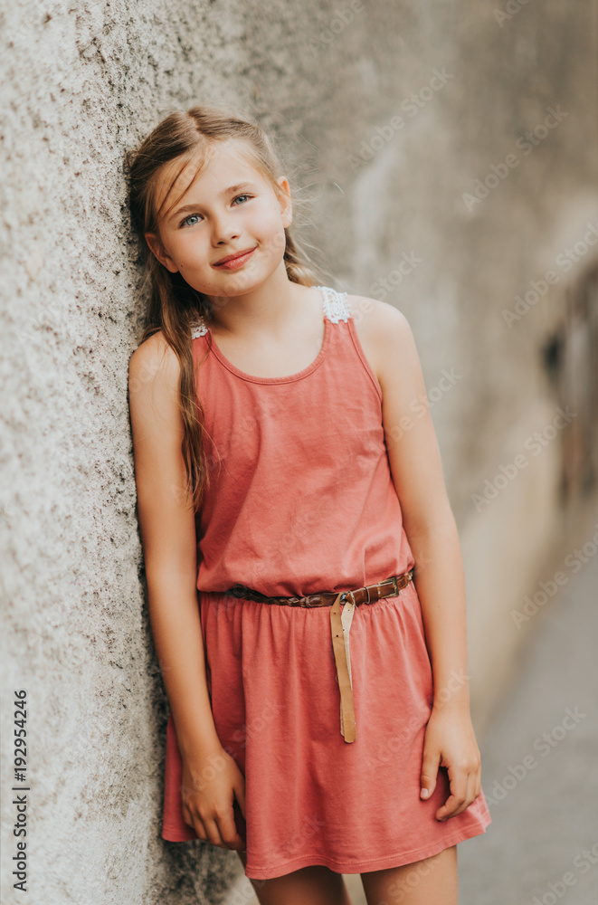 Outdoor portrait of pretty kid girl wearing summer dress Outdoor portrait of pretty kid girl wearing summer dress