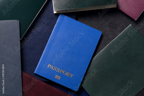 background of documents, passport in the foreground