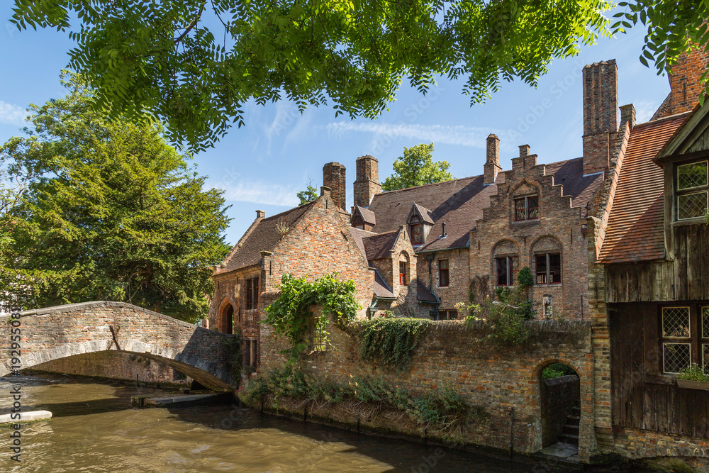 Bonifacius Bridge in Bruges, Belgium. A pedestrian bridge with romantic views of the canal and town Bonifacius Bridge in Bruges, Belgium. A pedestrian bridge with romantic views of the canal and town