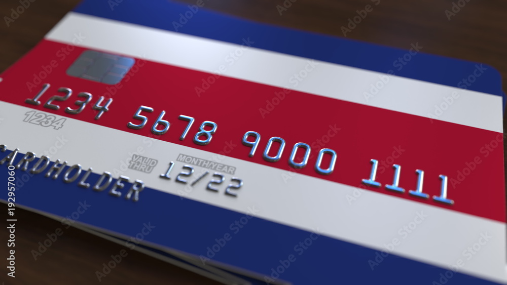 Plastic bank card featuring flag of Costa Rica. National banking system related 3D rendering