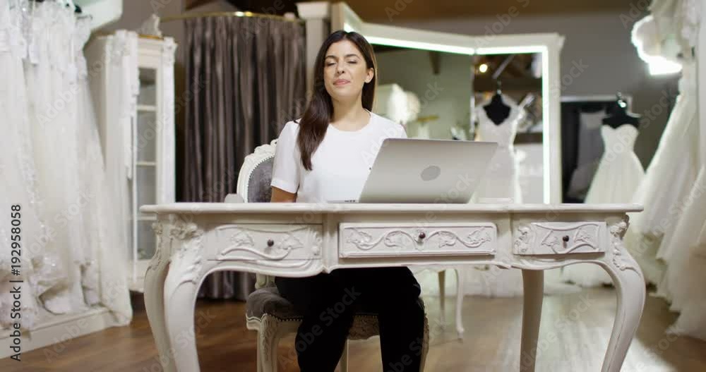 4K Happy new business owner in bridal wear boutique holds up 'open' sign. Slow motion. 4K Happy new business owner in bridal wear boutique holds up 'open' sign. Slow motion.