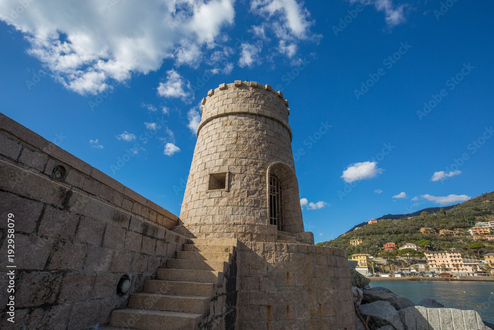 View of the tower on the sea in the city of Recco , Genoa (Genova) Province, Liguria, Mediterranean coast, Italy