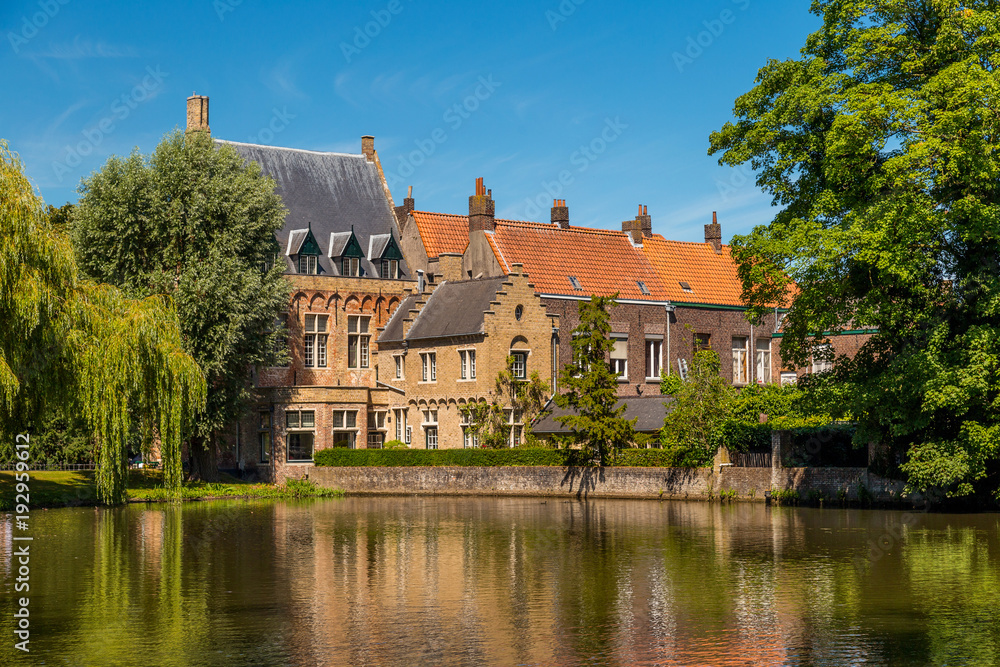 Brick houses on the lake Minnewater in Bruges, Belgium