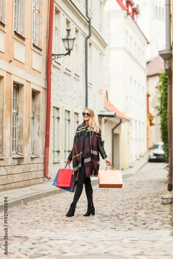 Modern model walks on old town fashion streets