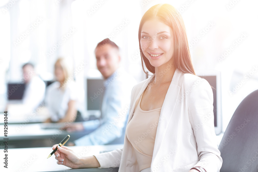 portrait of a female assistant sitting at a Desk portrait of a female assistant sitting at a Desk