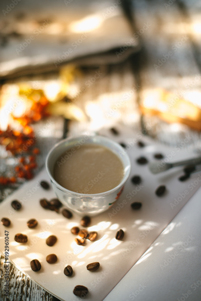 A cup of coffee in the morning sun. A cup of coffee in the morning sun.