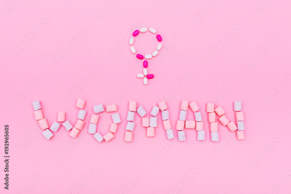 the inscription the Woman laid out the marshmallows with gender sign on pink background