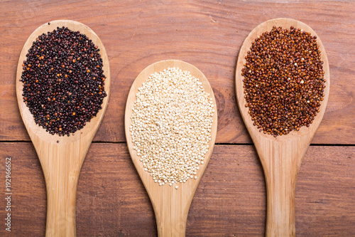 Black , white and red quinoa in spoon