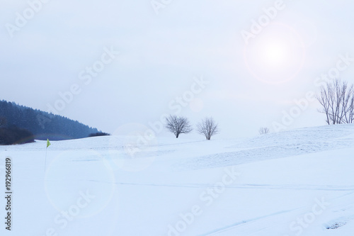 Winter landscape for skiing with lens flare