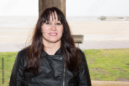 forties Portrait Of Smiling Brunette Woman Outdoors
