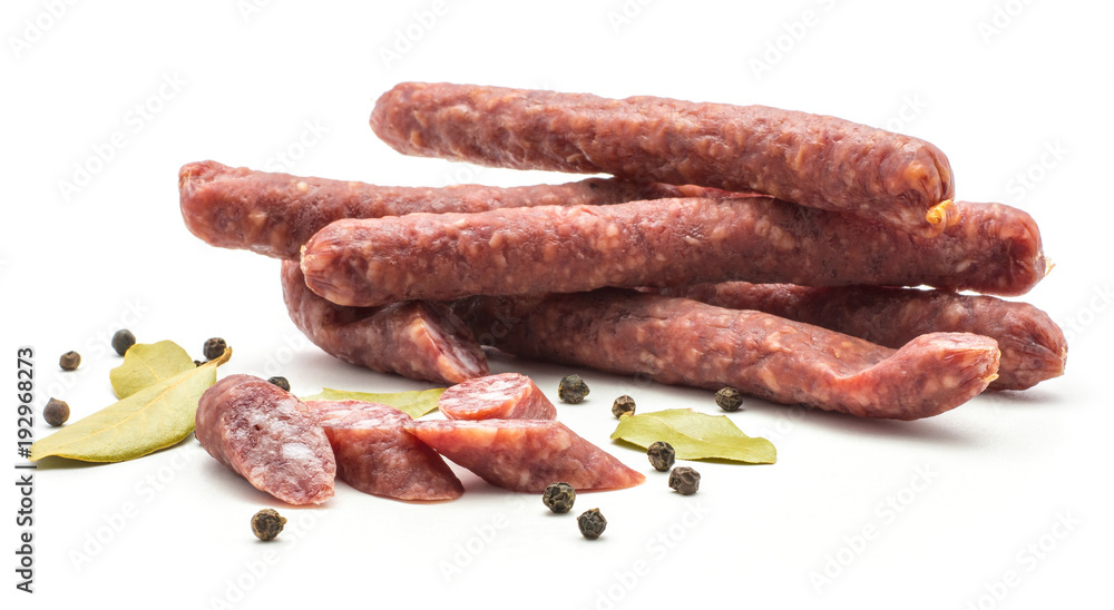 Hungarian dry sausages pepperoni set with black pepper and bay leaves isolated on white background smoked in natural casing mixed pork and beef. Hungarian dry sausages pepperoni set with black pepper and bay leaves isolated on white background smoked in natural casing mixed pork and beef.