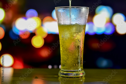 A glass of drink with bokeh background