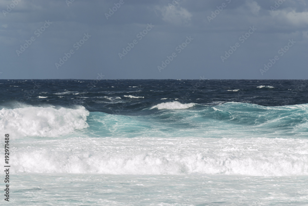 Rough turquoise sea with big waves and surf at La Santa, Lanzarote, Canary Islands, Spain