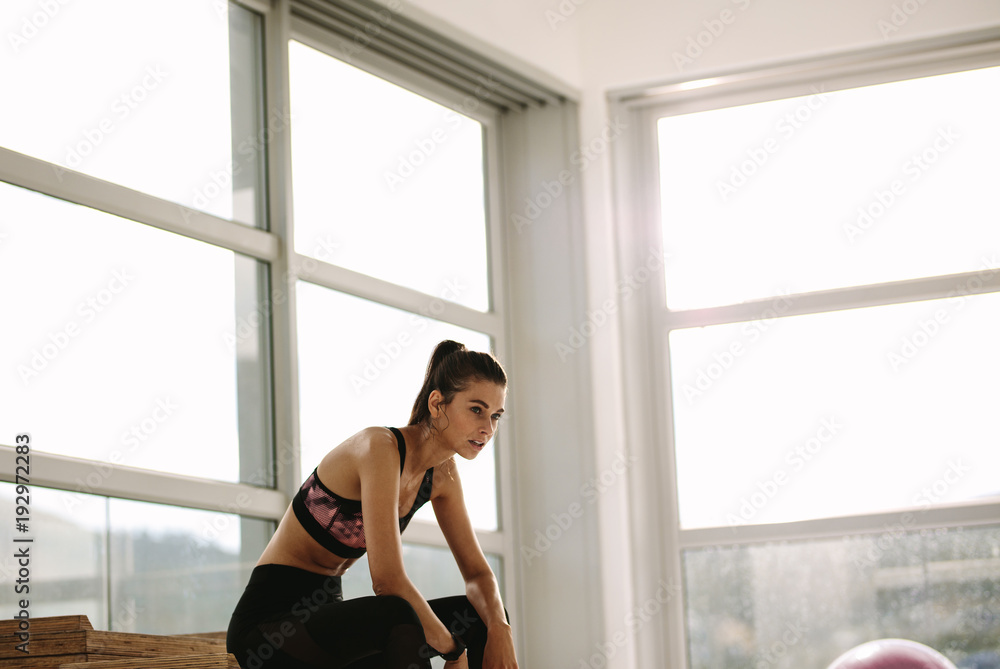 Woman taking break after exercising Woman taking break after exercising