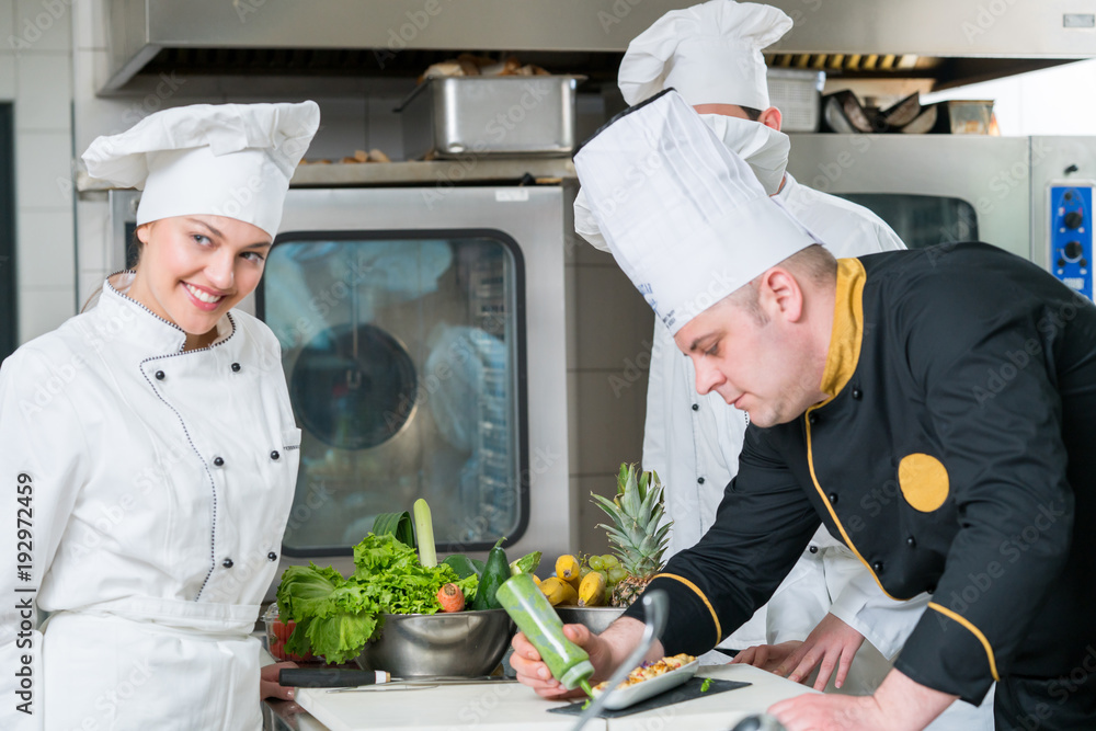 Chef Cooking, Cutting and preparing next plate Chef Cooking, Cutting and preparing next plate