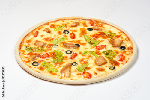 Pizza Caesar with chicken, cherry and olives on a white background