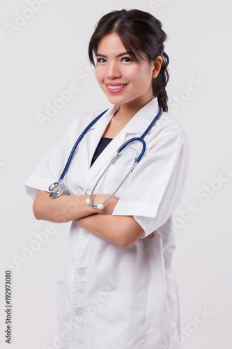 smart woman doctor portrait, confident happy smiling asian female doctor, woman surgeon, woman physician, hospital worker, health care profession or medical staff studio white isolated portrait