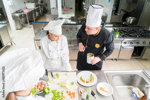 Chef Cooking, Cutting and preparing next plate