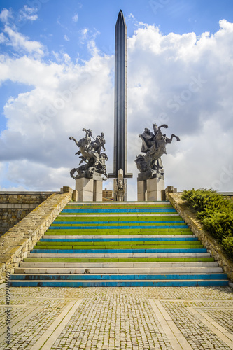 Asenevtsi monument in Veliko Tarnovo surrounding by traditional houses photo