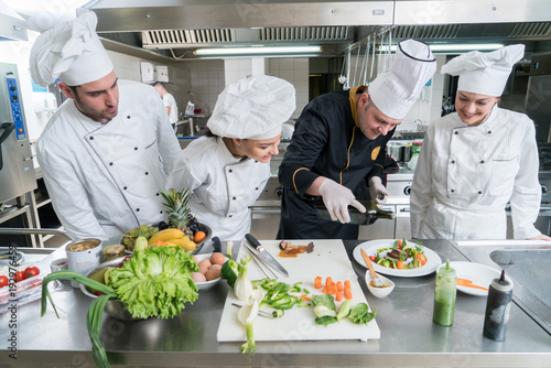 Chef Cooking, Cutting and preparing next plate