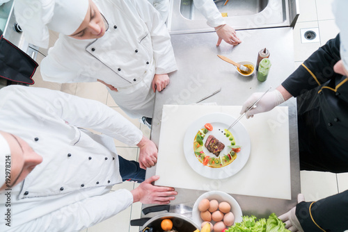 Chef Cooking, Cutting and preparing next plate