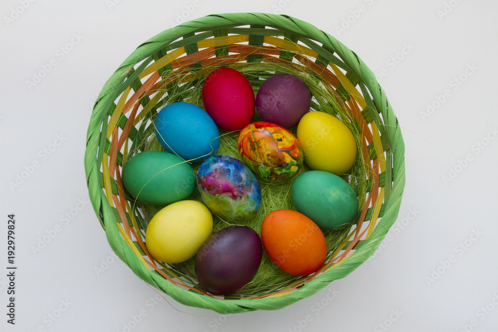 Easter eggs. Handmade painted eggs in basket for Easter celebration isolated on white background. Easter. Colored Easter eggs. Colorful egg. Copy space. Text space. Unique handmade painted eggs. Easter eggs. Handmade painted eggs in basket for Easter celebration isolated on white background. Easter. Colored Easter eggs. Colorful egg. Copy space. Text space. Unique handmade painted eggs.