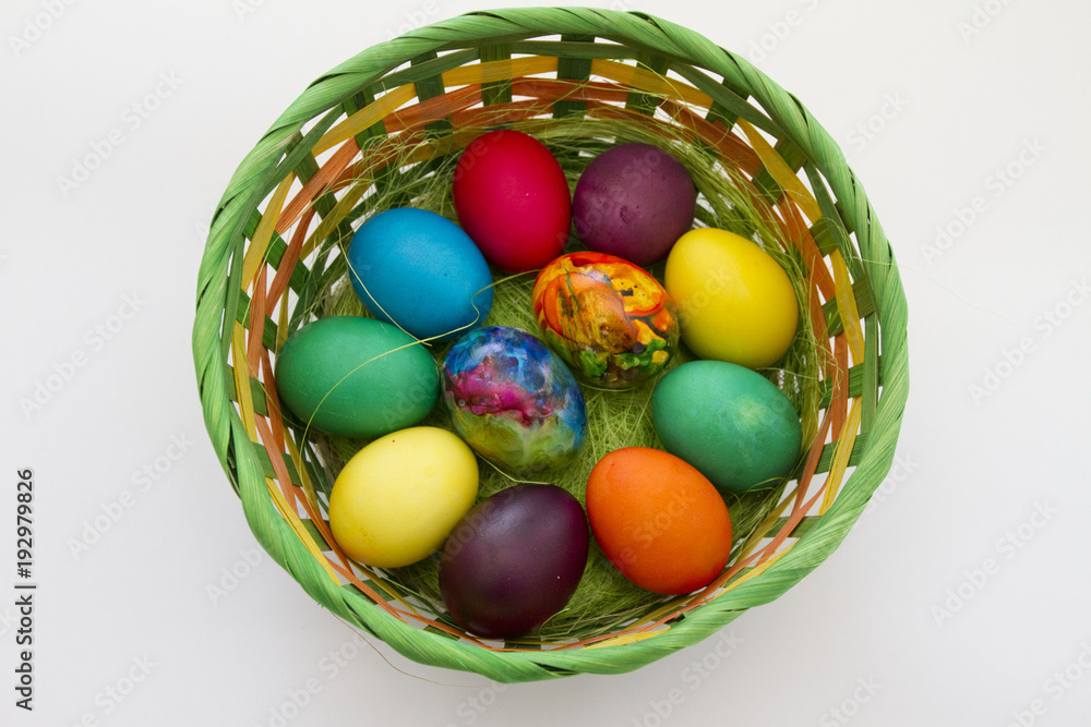 Easter eggs. Handmade painted eggs in basket for Easter celebration isolated on white background. Easter. Colored Easter eggs. Colorful egg. Copy space. Text space. Unique handmade painted eggs. Easter eggs. Handmade painted eggs in basket for Easter celebration isolated on white background. Easter. Colored Easter eggs. Colorful egg. Copy space. Text space. Unique handmade painted eggs.