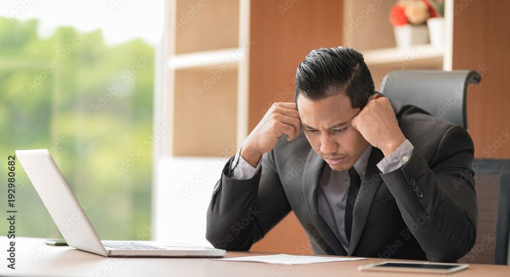 Businessman stressful from conference during working.Setup studio shooting. Businessman stressful from conference during working.Setup studio shooting.