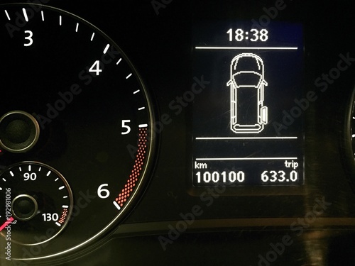 Detail of vehicle dashboard with daily kilometers and part of revolution counter