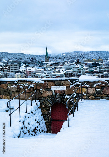 Kristiansand, Norway: Winter in Kristiansand City. The Crown Prince Frederiks gate at Odderoya in front, Kristiansand city in the background. Snow covered city seen from Odderoya. photo