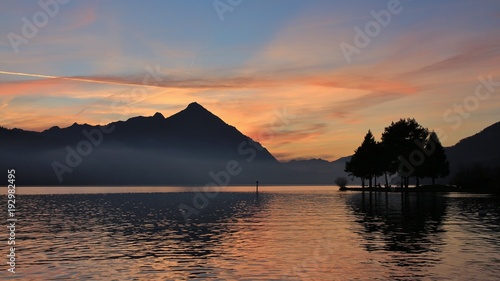 Mount Niesen at sunset. Colorful clouds over lake Thunersee. View from Neuhaus, Switzerland.