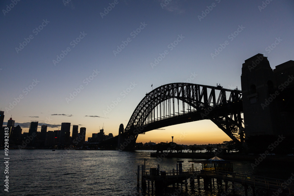 Obraz premium A silhouette of Sydney harbour bridge at sunset. Sydney, Australia.