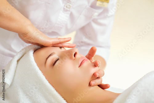 Beautiful woman at a facial massage at a spa salon.