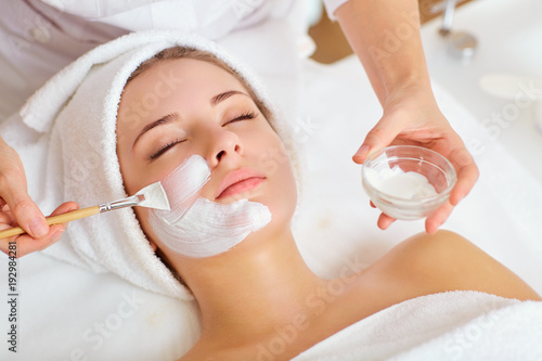 Tela Woman in mask on face in spa beauty salon.