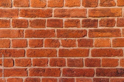 Brick wall texture background. Red brick texture. Builduing facade. Empty room with brick wall. Gradient for background usage. Abstract close up shot.