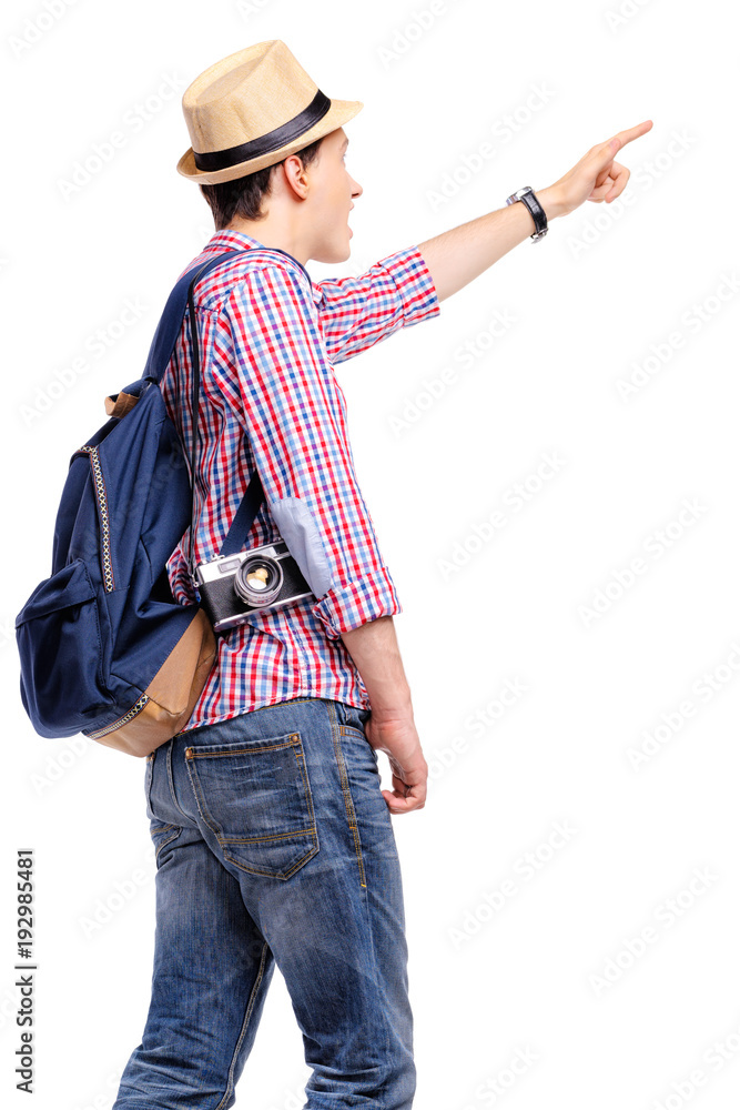 Guide showing sights. Travel concept. Studio portrait of young man in hat pointing away. Isolated on white. Guide showing sights. Travel concept. Studio portrait of young man in hat pointing away. Isolated on white.