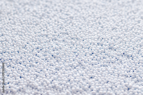 Polymer additive in granules, background texture