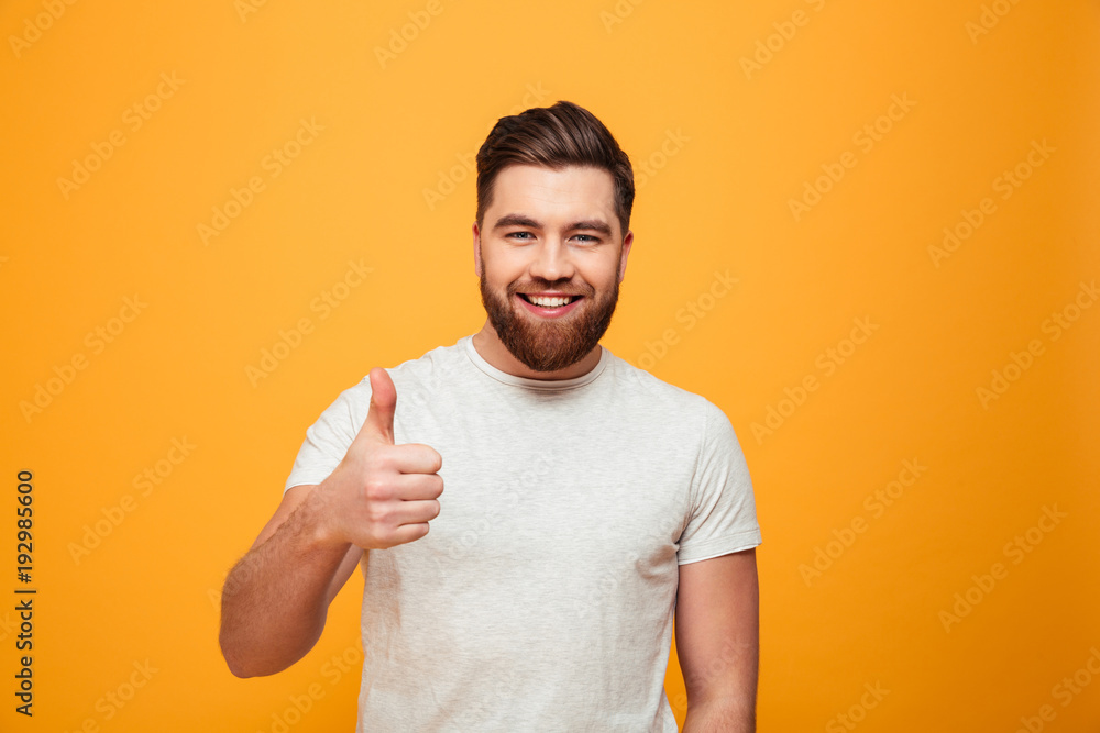 Portrait of a happy bearded man showing thumbs up Portrait of a happy bearded man showing thumbs up
