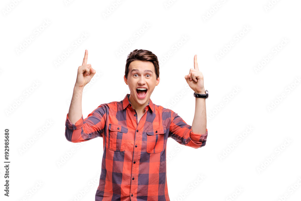 Your text here. Studio portrait of happy handsome young man pointing copy space. Isolated on white. Your text here. Studio portrait of happy handsome young man pointing copy space. Isolated on white.