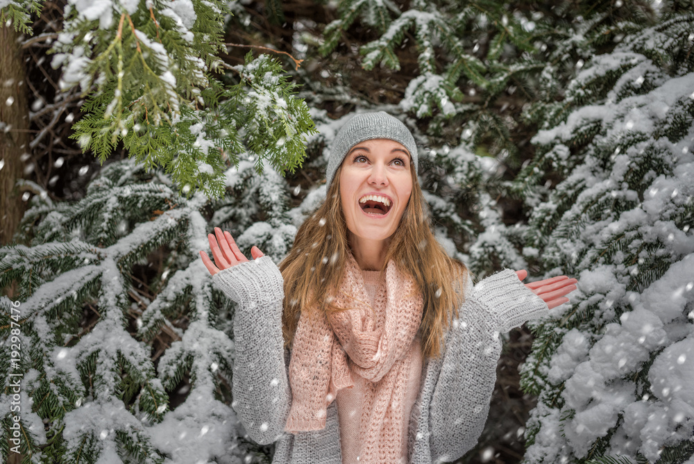 Happy young woman walking in winter time Happy young woman walking in winter time