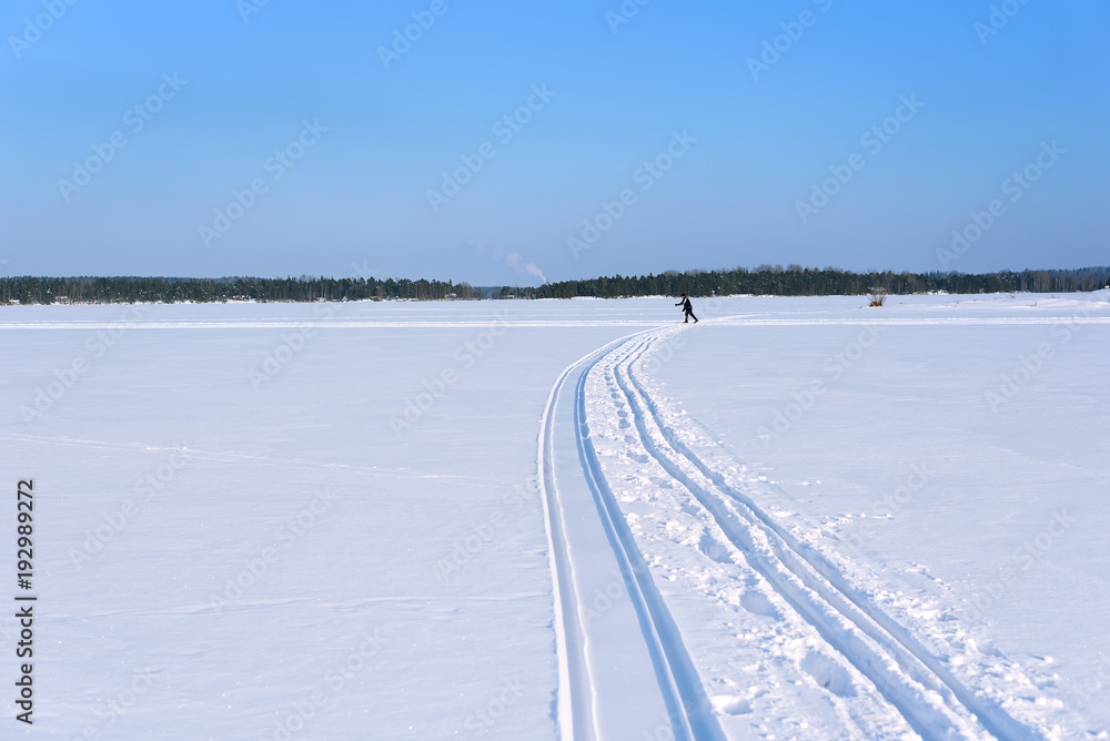 A skier skiing on the ice of Lake Saimaa, Lappeenranta, Finland