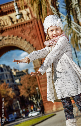 smiling modern child in Barcelona, Spain photo